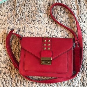 Carlos by Carlos Santana red bag. NWT
